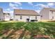Picture of a big backyard with green grass, a patio, and neighboring homes at 1109 Culver Spring Way, Charlotte, NC 28215