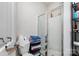 Clean bathroom features a glass-enclosed shower, white fixtures, and ample storage space at 1109 Culver Spring Way, Charlotte, NC 28215