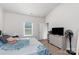 Bright bedroom features soft carpet, vaulted ceiling, and a large window with blinds at 1109 Culver Spring Way, Charlotte, NC 28215