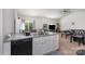 Modern kitchen seamlessly flows into the living area, creating a perfect space for cooking and entertaining at 1109 Culver Spring Way, Charlotte, NC 28215