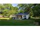 Charming one-story home with a cozy covered patio and a spacious backyard, perfect for outdoor activities at 116 Barnes Ln, Stony Point, NC 28678