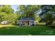 Charming one-story home with a cozy covered patio and a spacious backyard, surrounded by mature trees at 116 Barnes Ln, Stony Point, NC 28678