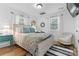 Bright bedroom with wooden floors, large bed, accent chair, and natural light at 116 Barnes Ln, Stony Point, NC 28678