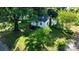 Charming one-story home with a landscaped yard and mature trees, creating a serene outdoor space at 116 Barnes Ln, Stony Point, NC 28678