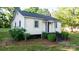 Charming single-story home with landscaped front yard, brick stairs, and covered entry at 116 Barnes Ln, Stony Point, NC 28678