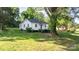 Lovely single-story home boasts lush lawn and landscaping, complemented by mature trees and a mailbox at 116 Barnes Ln, Stony Point, NC 28678