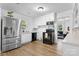 Bright kitchen features modern stainless steel refrigerator and black appliances at 116 Barnes Ln, Stony Point, NC 28678