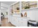 Pantry featuring white cabinets, open shelving, modern decor, and wood-look flooring at 116 Barnes Ln, Stony Point, NC 28678