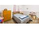 Bedroom includes a bed, wooden dresser, and small nightstand, with light pink paint and carpeted floor at 117 Ethel Ln, Statesville, NC 28625