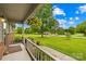 View from covered porch onto a large front lawn and mature shade trees at 117 Ethel Ln, Statesville, NC 28625
