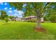 Charming single-story home with well-maintained lawn, tree, and cozy front porch at 117 Ethel Ln, Statesville, NC 28625