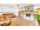 Warm and inviting living room features a brick fireplace and neutral furnishings at 117 Ethel Ln, Statesville, NC 28625