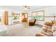 Comfortable living room with neutral carpet, classic wood trim, and a ceiling fan at 117 Ethel Ln, Statesville, NC 28625