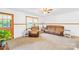Inviting living room with neutral carpet, a cozy sofa, and ample natural light at 117 Ethel Ln, Statesville, NC 28625