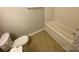 Standard bathroom with a toilet and bathtub at 118 Steam Engine Dr # 201, Mooresville, NC 28115
