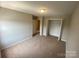 Bedroom with neutral walls and carpet, providing a bright and airy feel at 118 Steam Engine Dr # 201, Mooresville, NC 28115