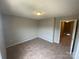 Neutral carpeted bedroom with standard lighting at 118 Steam Engine Dr # 201, Mooresville, NC 28115