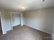 Neutral bedroom with carpeted floors, closet and a single overhead light at 118 Steam Engine Dr # 201, Mooresville, NC 28115