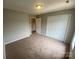 Bedroom with natural light, a closet, and neutral carpet flooring at 118 Steam Engine Dr # 201, Mooresville, NC 28115