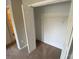 Bright, neutral closet with standard wire shelving and bi-fold doors at 118 Steam Engine Dr # 201, Mooresville, NC 28115
