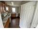 This kitchen has wood cabinets, white appliances, and a window at 118 Steam Engine Dr # 201, Mooresville, NC 28115