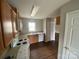 Cozy kitchen with wood cabinets, white appliances, and stainless steel sink at 118 Steam Engine Dr # 201, Mooresville, NC 28115