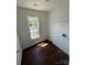 Bright laundry room with wood floors and ample natural light at 118 Steam Engine Dr # 201, Mooresville, NC 28115