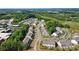Panoramic aerial view of a residential community with tree-lined streets and well-kept townhomes at 12021 Basking Dr, Charlotte, NC 28214