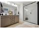 Modern bathroom features a double sink vanity, glass-enclosed shower, and neutral tones at 12021 Basking Dr, Charlotte, NC 28214
