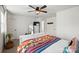 Bedroom with a white bed frame, ceiling fan, and dresser with mirror at 12021 Basking Dr, Charlotte, NC 28214