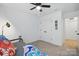Bedroom with a twin bed, ceiling fan, and closet at 12021 Basking Dr, Charlotte, NC 28214
