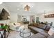 Open-concept living room flowing into the kitchen and dining areas, perfect for modern living at 12021 Basking Dr, Charlotte, NC 28214