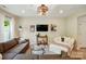 Bright and airy living room with a large comfortable sofa, stylish decor, and plenty of natural light at 12021 Basking Dr, Charlotte, NC 28214