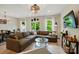 Comfortable living room featuring a large sectional sofa, wood floors, and inviting decor at 12021 Basking Dr, Charlotte, NC 28214