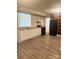 Functional kitchen with white cabinets, black appliances, and new flooring for easy maintenance at 1336 Norris Ave, Charlotte, NC 28206