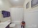 A cozy bathroom with a tub, shower, and decorative accents to add charm and comfort to the space at 135 Henry Putnam Dr, Cherryville, NC 28021