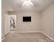 A carpeted bedroom with a ceiling fan and large window provides a comfortable living space at 135 Henry Putnam Dr, Cherryville, NC 28021