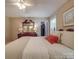 Bedroom featuring a queen bed, wooden dresser, closet, and neutral paint at 135 Henry Putnam Dr, Cherryville, NC 28021