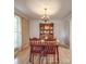Cozy dining area with hardwood floors, decorative wainscoting, and a wooden table with chairs at 135 Henry Putnam Dr, Cherryville, NC 28021