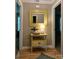 Hallway with wood floors, neutral walls, and a yellow table with a decorative mirror at 135 Henry Putnam Dr, Cherryville, NC 28021