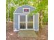 A sturdy storage shed with a ramp and double doors, perfect for storing outdoor gear at 135 Henry Putnam Dr, Cherryville, NC 28021