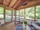 Bright sunroom with wood floors, and comfortable seating area, perfect for relaxing at 135 Henry Putnam Dr, Cherryville, NC 28021