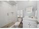 Modern bathroom with a glass enclosed shower and marble countertops at 13602 Huntson Park Ln, Huntersville, NC 28078