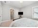 Calm bedroom with large bed and TV on stand at 13602 Huntson Park Ln, Huntersville, NC 28078
