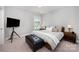 Bright bedroom with large bed, stylish decor, and ample natural light at 13602 Huntson Park Ln, Huntersville, NC 28078