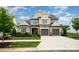Charming two-story home features stone accents, a two-car garage, and manicured landscaping at 13602 Huntson Park Ln, Huntersville, NC 28078