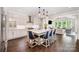 Gourmet kitchen features a center island with bar seating, stainless steel appliances, and hardwood floors at 13602 Huntson Park Ln, Huntersville, NC 28078