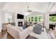 Living room features a fireplace, vaulted ceilings, lots of light, and access to the backyard at 13602 Huntson Park Ln, Huntersville, NC 28078