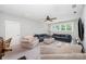 This living room features plush seating, gray walls, neutral carpet and ceiling fan at 13602 Huntson Park Ln, Huntersville, NC 28078