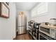 Convenient pantry space with a stainless steel refrigerator, shelving, and ample storage for kitchen essentials at 13602 Huntson Park Ln, Huntersville, NC 28078
